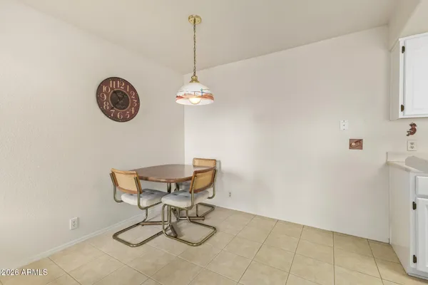 a view of a table and a chair in a room