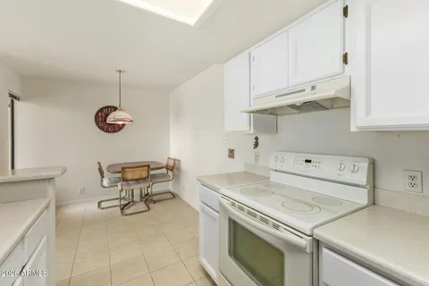 a view of an empty room with a ceiling fan