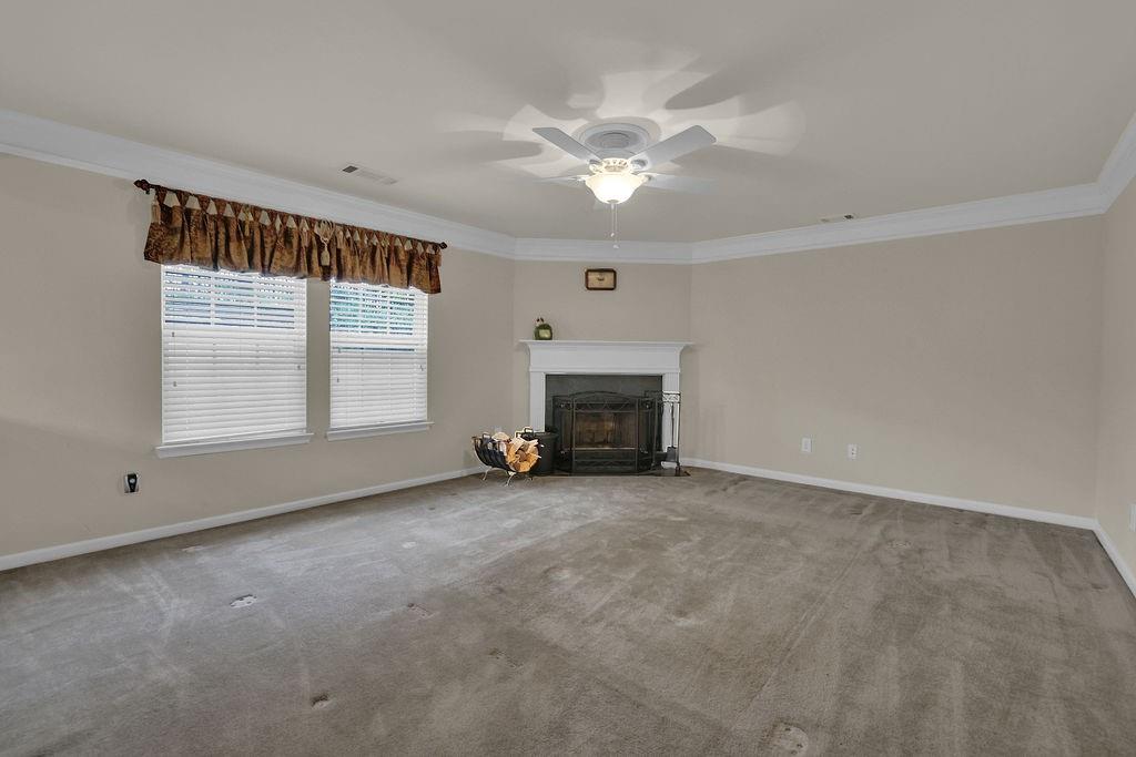 3160 Centerglen Lane Cumming, GA 30040 - Photo 18 of 40 an empty room with windows and fireplace