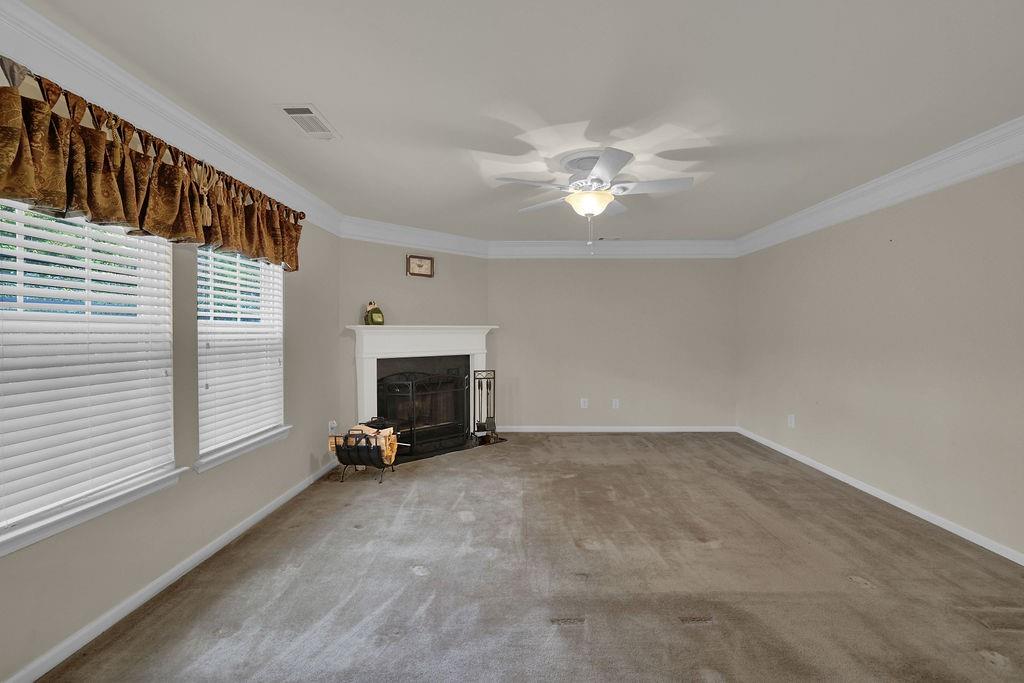3160 Centerglen Lane Cumming, GA 30040 - Photo 19 of 40 a view of empty room with fireplace