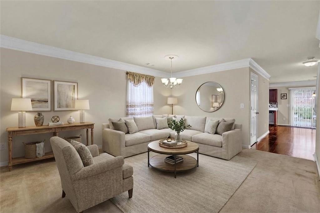 3160 Centerglen Lane Cumming, GA 30040 - Photo 2 of 40 a living room with furniture a rug and a large window