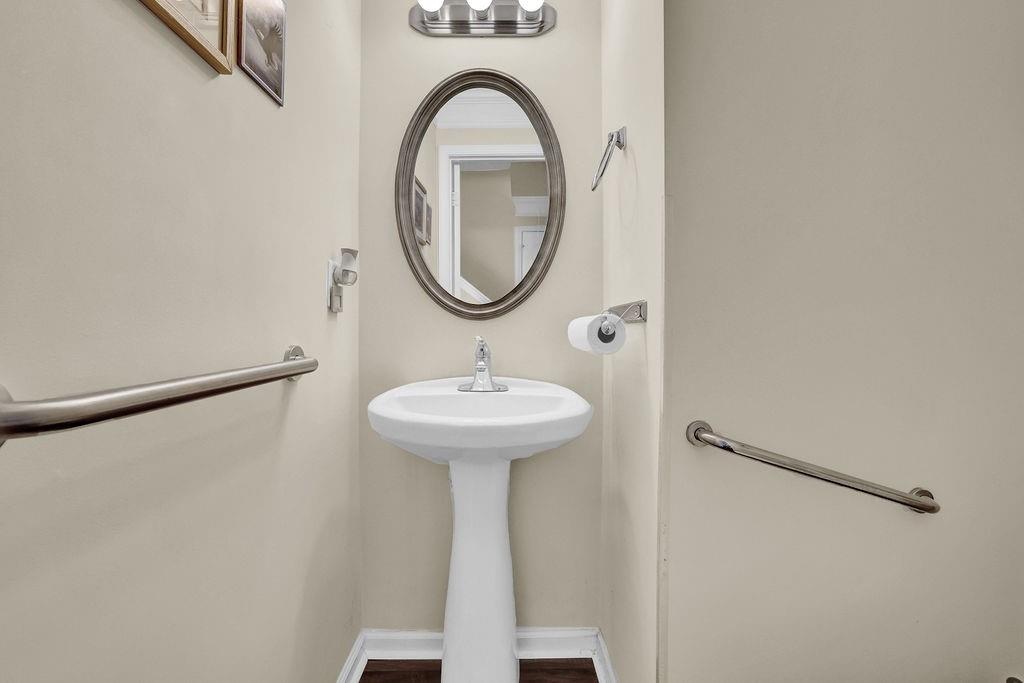 3160 Centerglen Lane Cumming, GA 30040 - Photo 21 of 40 a bathroom with a sink a mirror and a shower