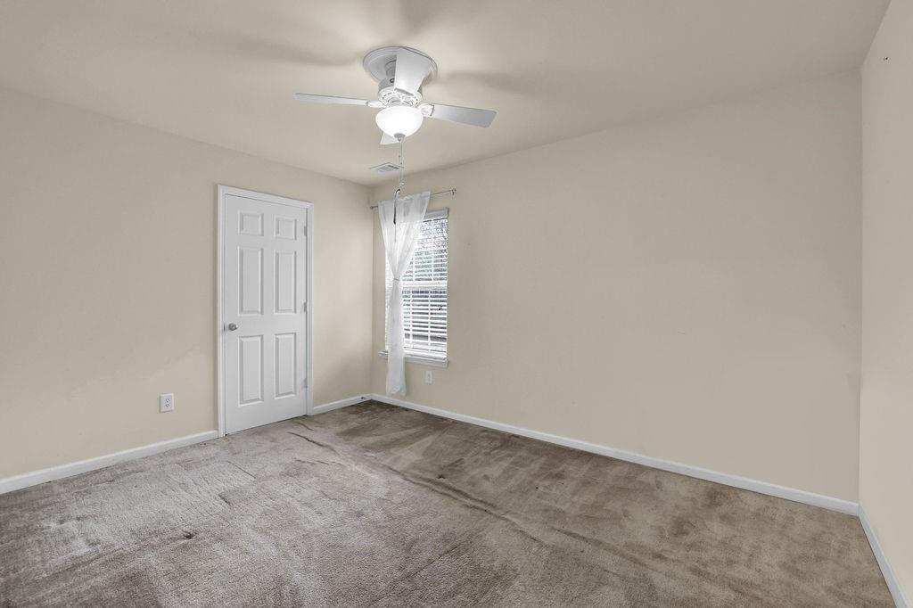 3160 Centerglen Lane Cumming, GA 30040 - Photo 25 of 40 a view of an empty room with a window