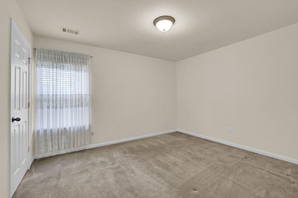 3160 Centerglen Lane Cumming, GA 30040 - Photo 27 of 40 an empty room with a window