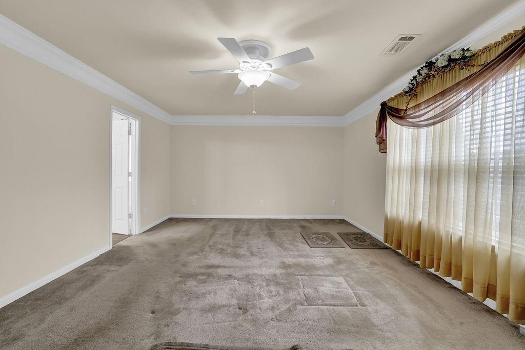 3160 Centerglen Lane Cumming, GA 30040 - Photo 29 of 40 an empty room with windows and fan