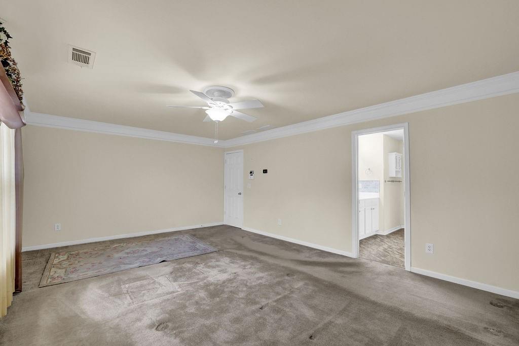 3160 Centerglen Lane Cumming, GA 30040 - Photo 31 of 40 a view of an empty room with a ceiling fan
