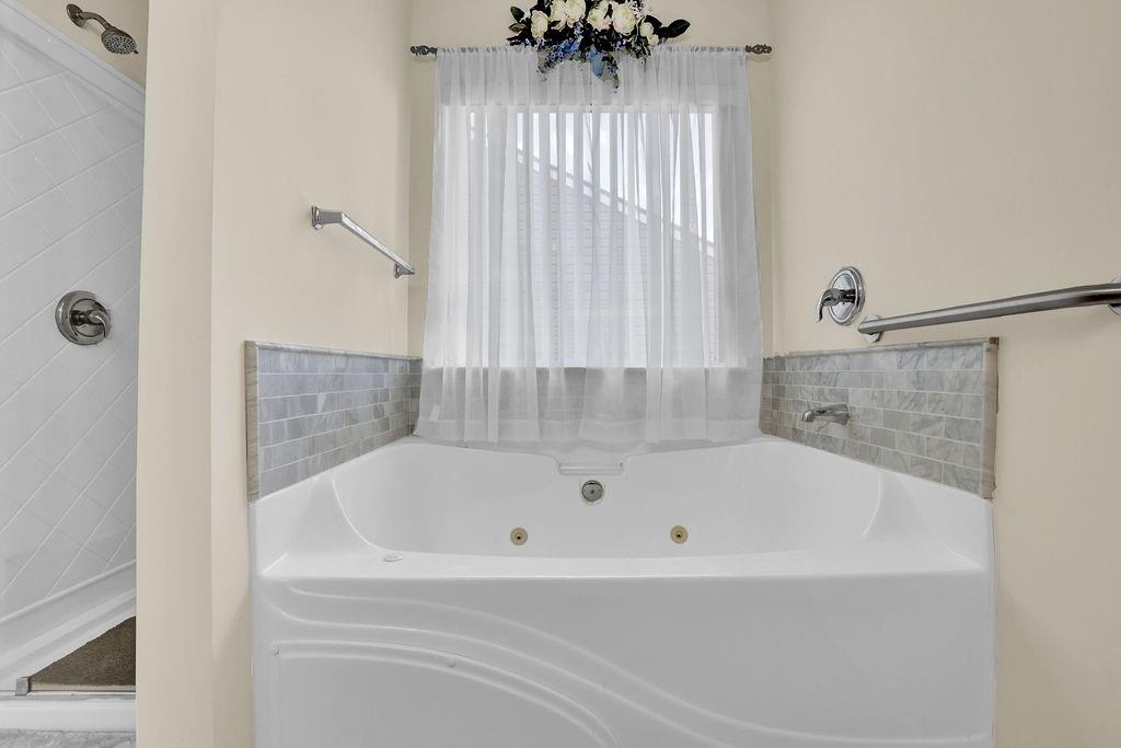 3160 Centerglen Lane Cumming, GA 30040 - Photo 35 of 40 a white bath tub sitting in a bathroom