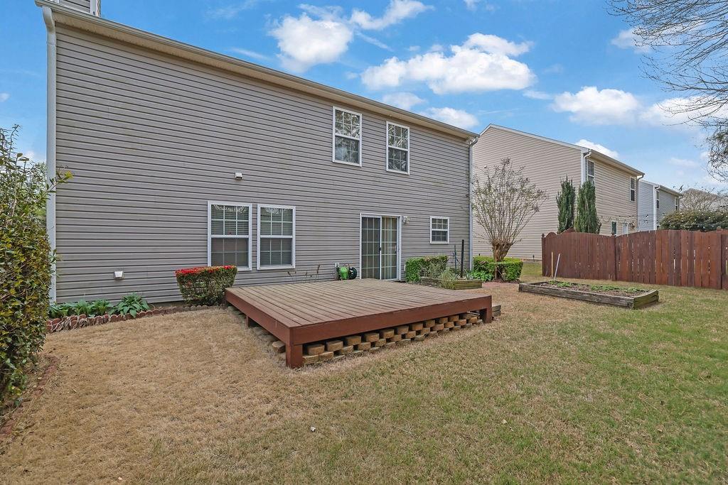 3160 Centerglen Lane Cumming, GA 30040 - Photo 39 of 40 a backyard of a house with barbeque oven and outdoor seating