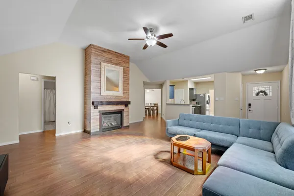 a living room with furniture and a fireplace