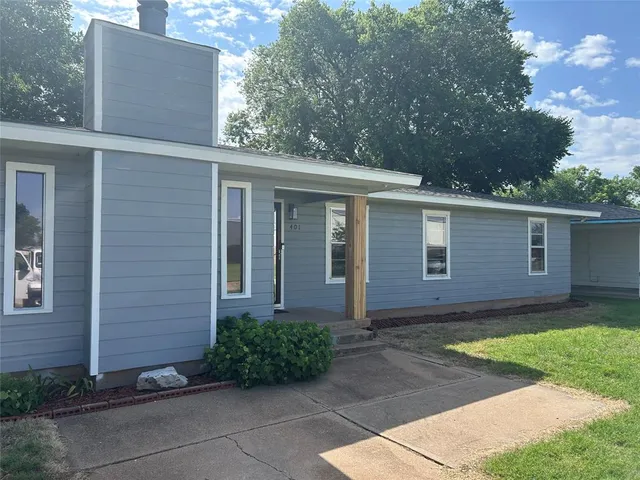 front view of a house with a yard