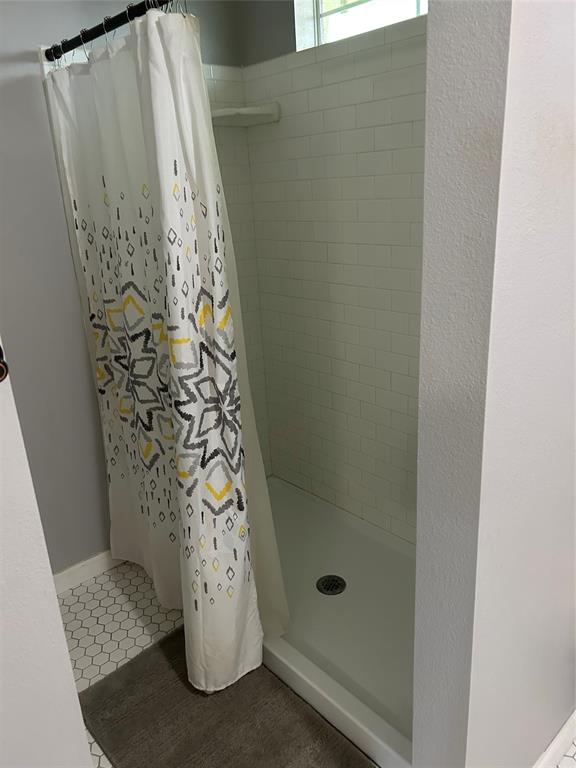 401 South Ave H Olney, TX 76374 - Photo 12 of 22 a bathroom with a shower