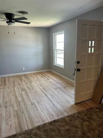 a view of empty room with windows