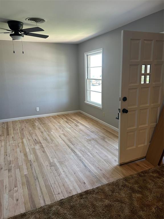 401 South Ave H Olney, TX 76374 - Photo 18 of 22 a view of empty room with windows