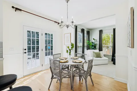 a view of a dining room with furniture window and outside view