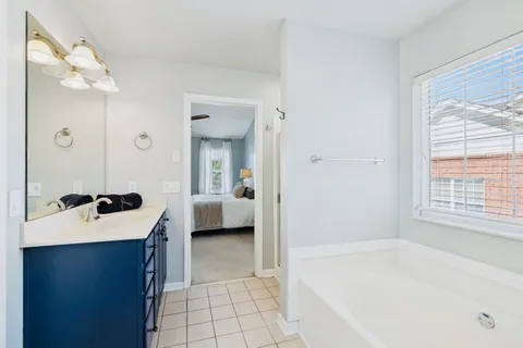 a en suite bathroom with a sink and a bathtub