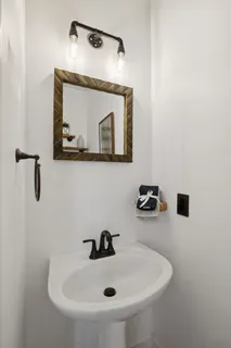 a view of a house with snow on the road