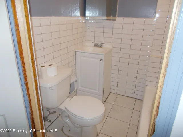 a bathroom with a sink and toilet