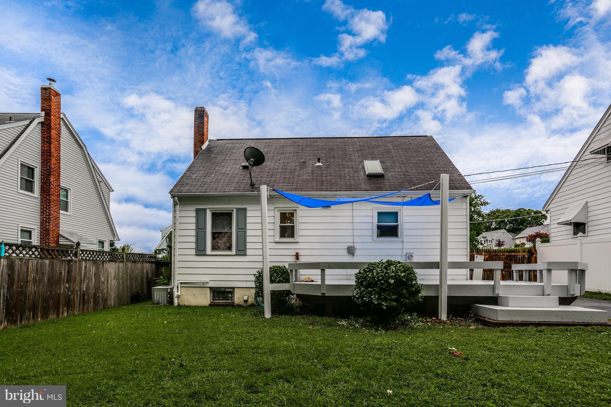 1254 June Road Baltimore, MD 21227 - Photo 23 of 23 a front view of a house with a yard