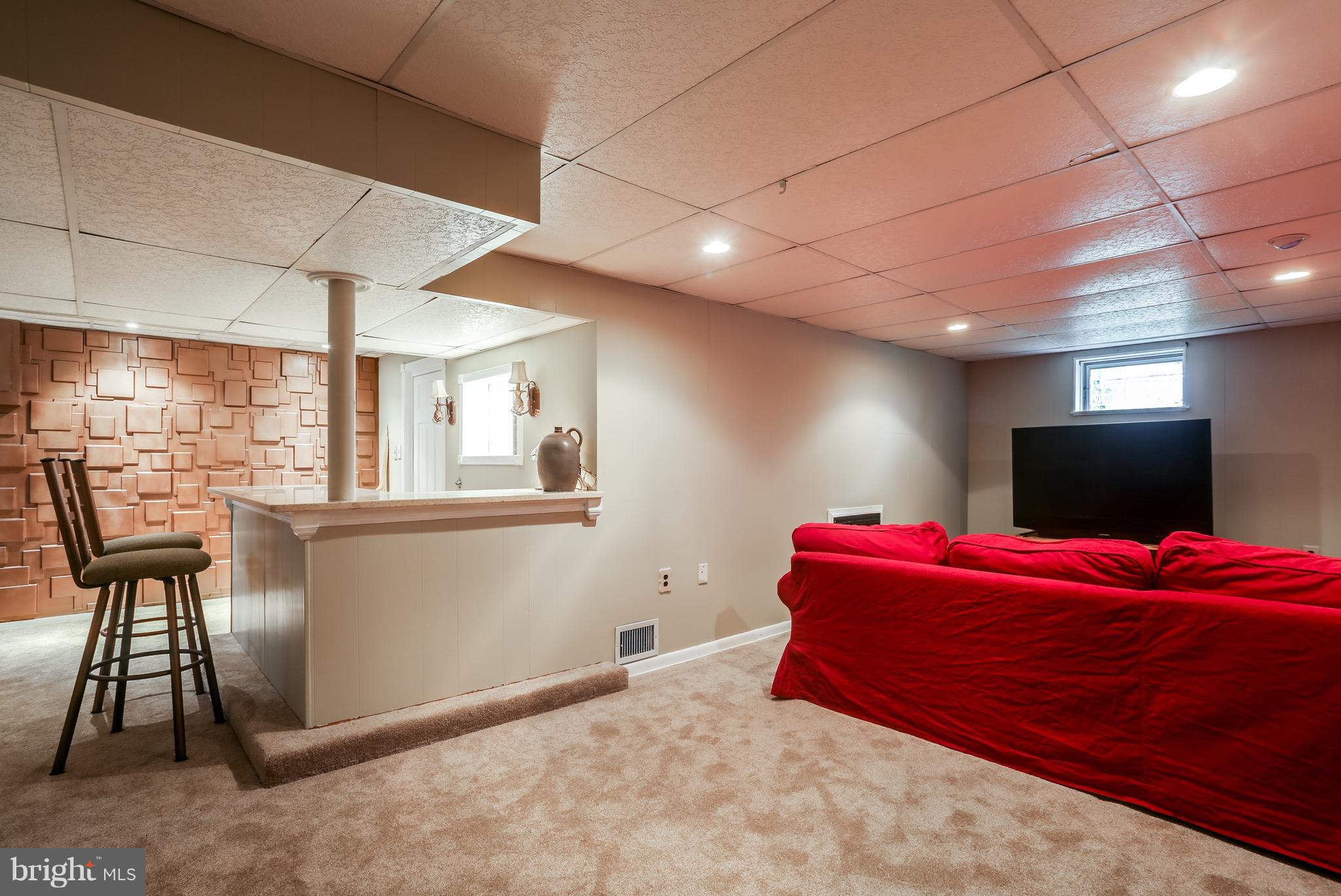 1254 June Road Baltimore, MD 21227 - Photo 6 of 23 a bedroom with a bed and a chandelier