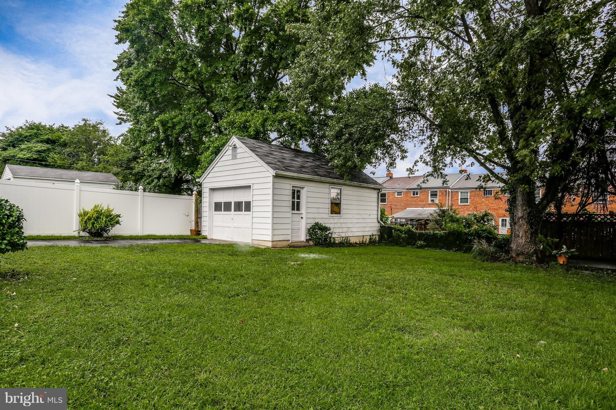 1254 June Road Baltimore, MD 21227 - Photo 7 of 23 a view of a house with backyard and garden