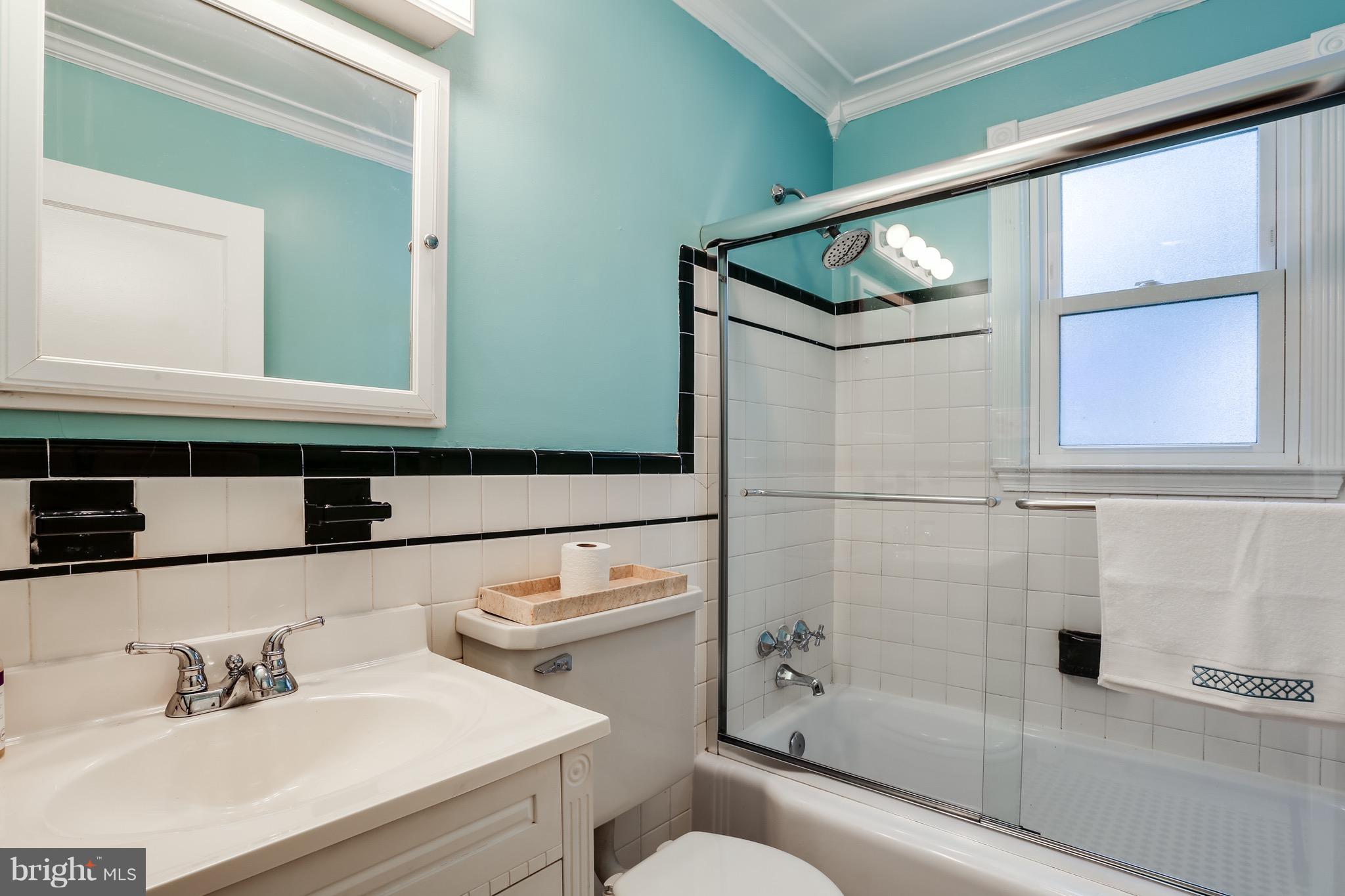 1254 June Road Baltimore, MD 21227 - Photo 10 of 23 a bathroom with a sink a toilet and shower