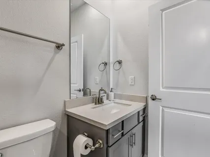 a bathroom with a shower and a toilet