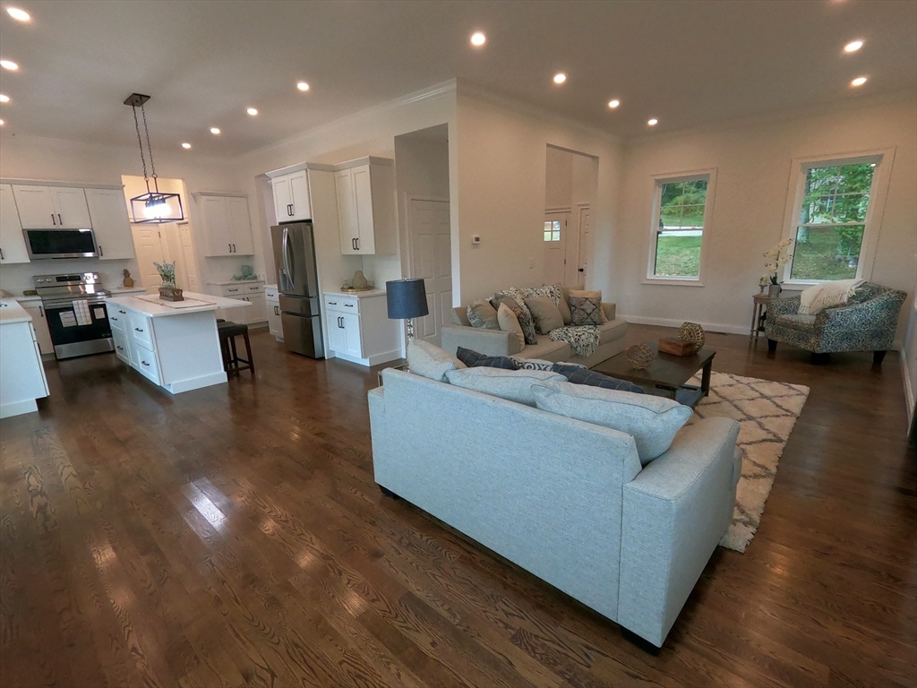 86 Berry Corner Road Charlton, MA 01507 - Photo 11 of 41 a living room with furniture and kitchen view