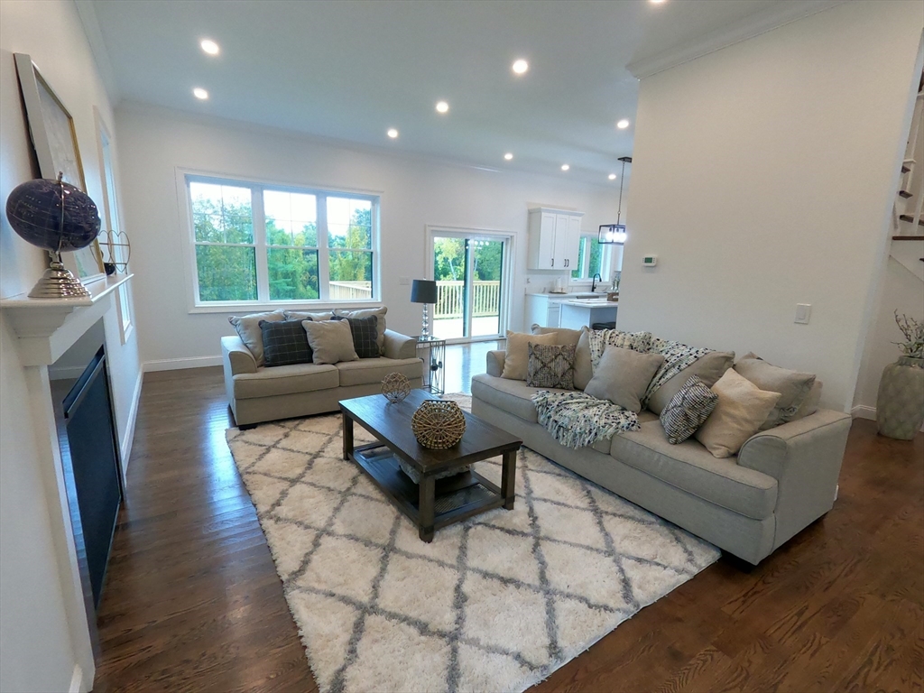 86 Berry Corner Road Charlton, MA 01507 - Photo 12 of 41 a living room with fireplace furniture and a large window