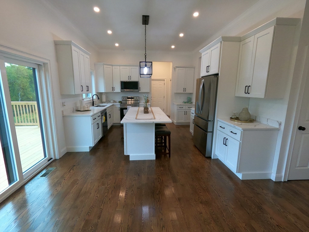 86 Berry Corner Road Charlton, MA 01507 - Photo 13 of 41 a kitchen with refrigerator and wooden floor