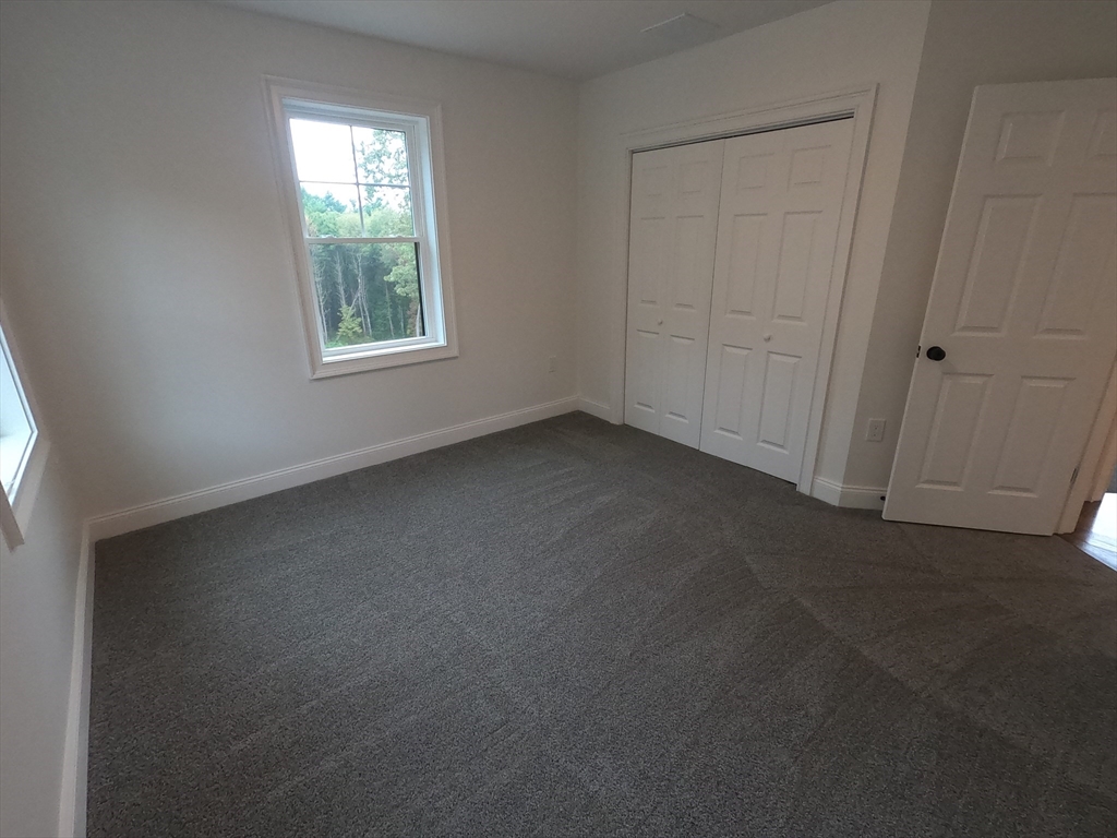 86 Berry Corner Road Charlton, MA 01507 - Photo 24 of 41 an empty room with windows