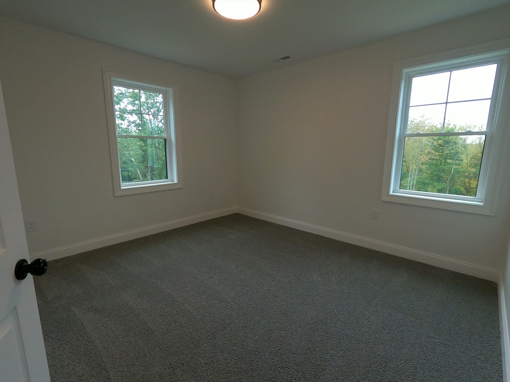 86 Berry Corner Road Charlton, MA 01507 - Photo 25 of 41 an empty room with a window