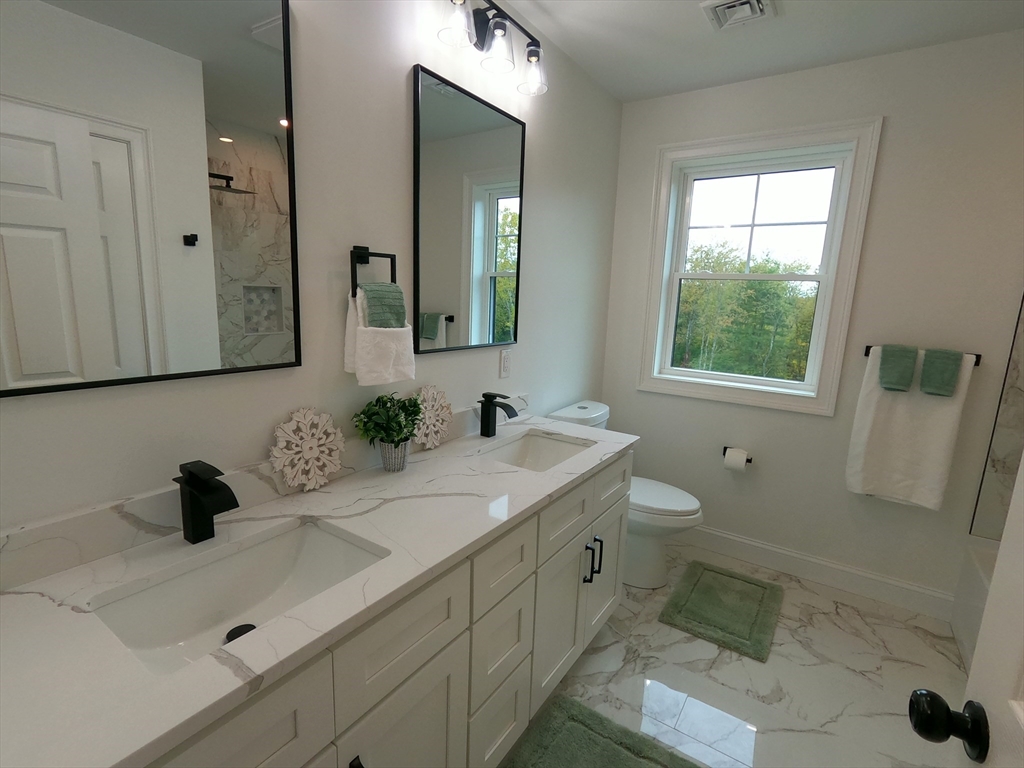 86 Berry Corner Road Charlton, MA 01507 - Photo 27 of 41 a bathroom with a sink and a mirror
