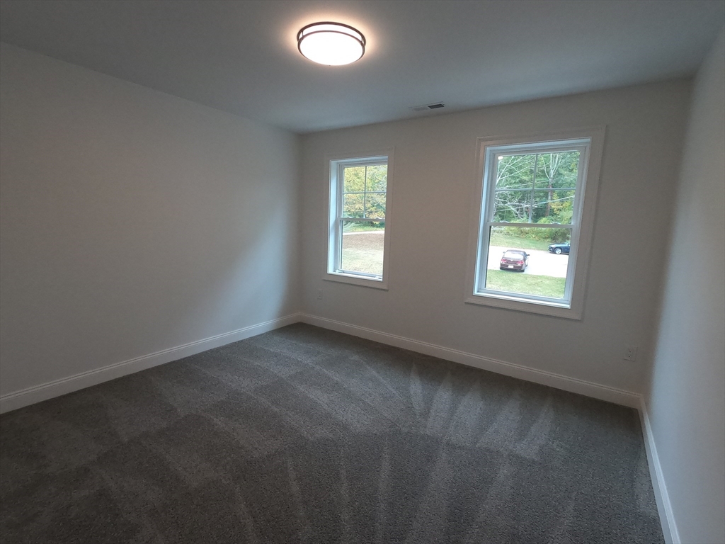 86 Berry Corner Road Charlton, MA 01507 - Photo 31 of 41 an empty room with windows