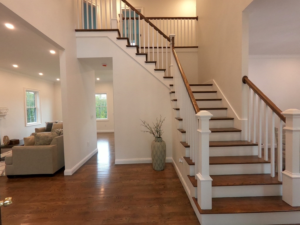 86 Berry Corner Road Charlton, MA 01507 - Photo 6 of 41 a view of entryway and hall with wooden floor