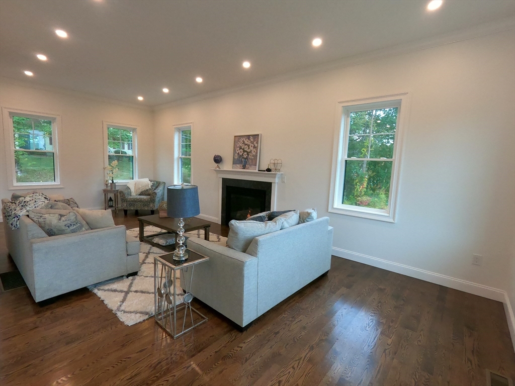 86 Berry Corner Road Charlton, MA 01507 - Photo 10 of 41 a living room with furniture and a fireplace