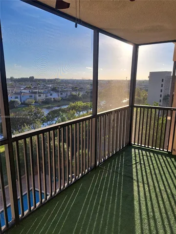 a view of balcony with wooden floor