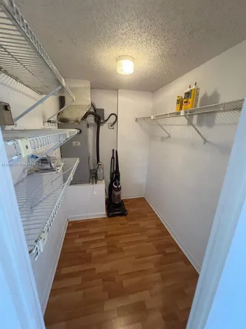 a view of a storage and utility room with stairs