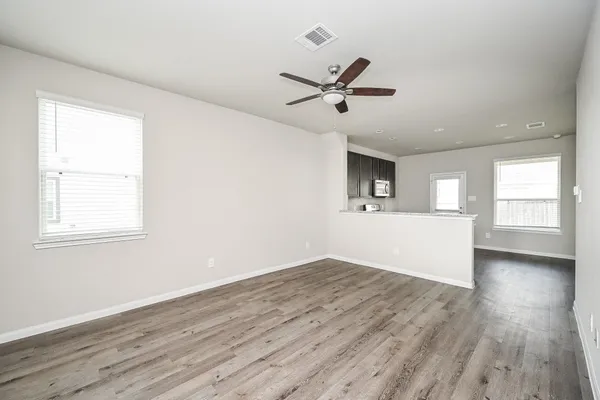 a view of an empty room with windows