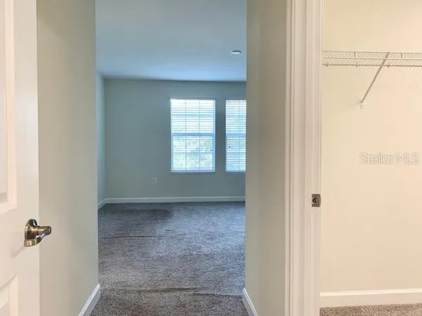 a view of an empty room with a window