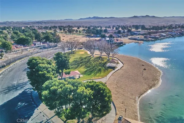 an aerial view of a house with a lake view