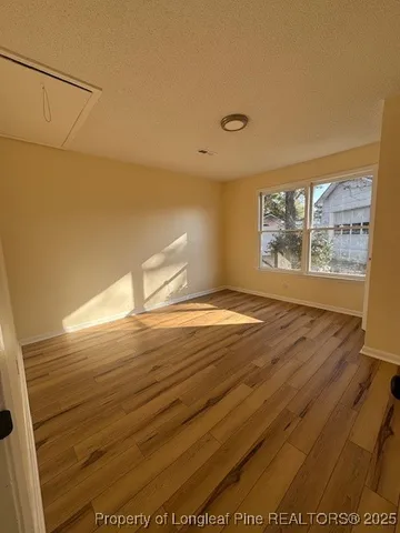 a view of a livingroom with a ceiling fan and window