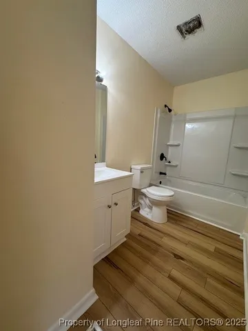 a balcony with view of trees in front of it