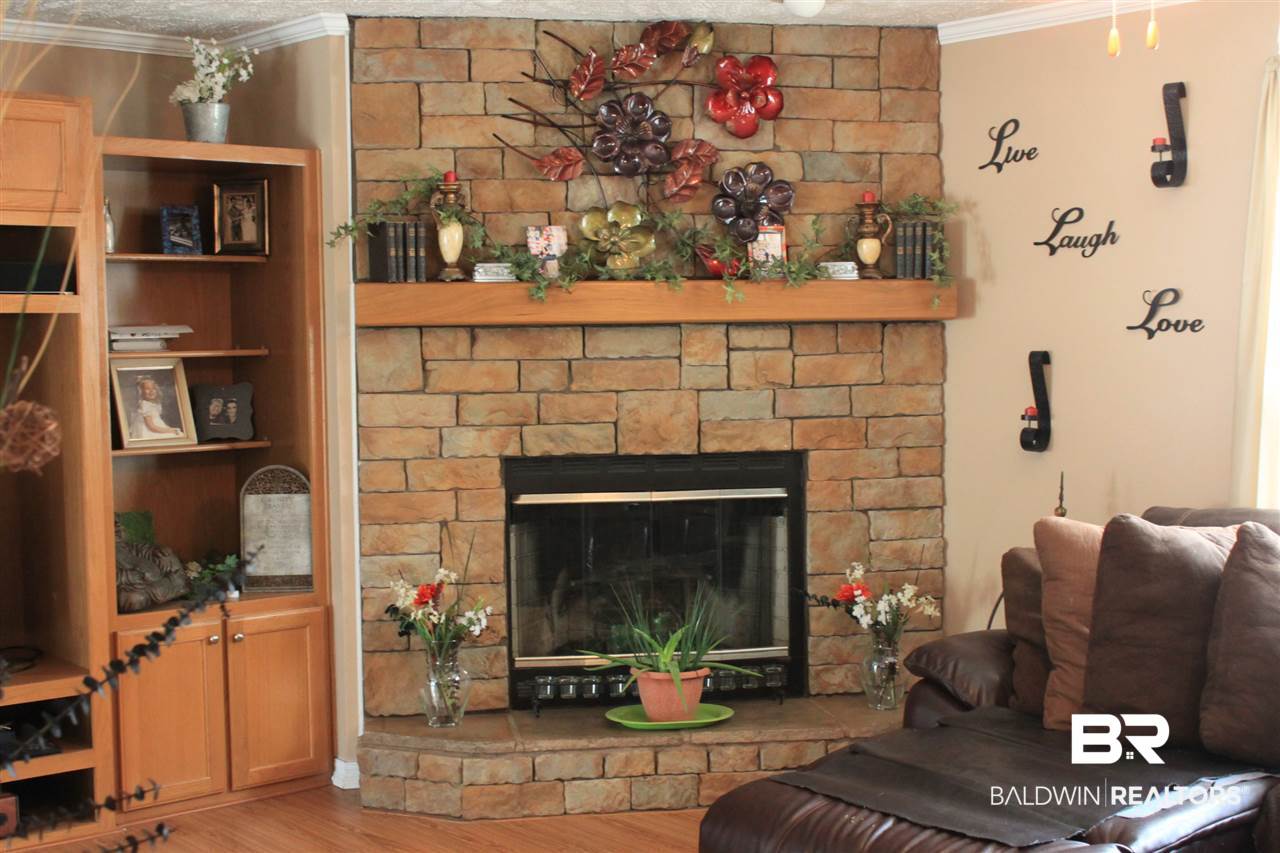 9380 Spice Pond Road Eight Mile, AL 36613 - Photo 18 of 36 Great room with wood burning stone clad fireplace.