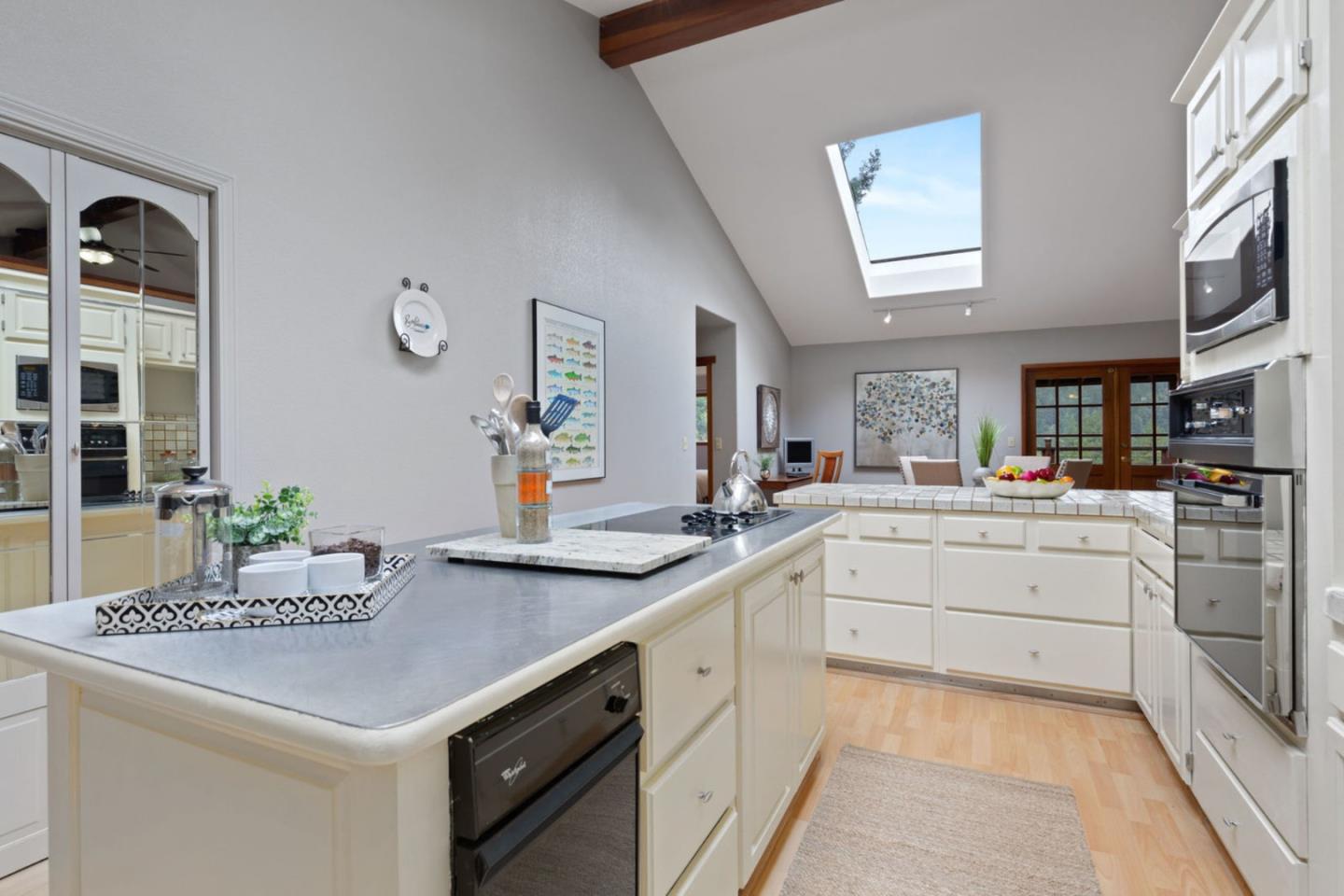 2060 Sparrow Valley Road Aptos, CA 95003 - Photo 14 of 45 a kitchen with white cabinets and sink