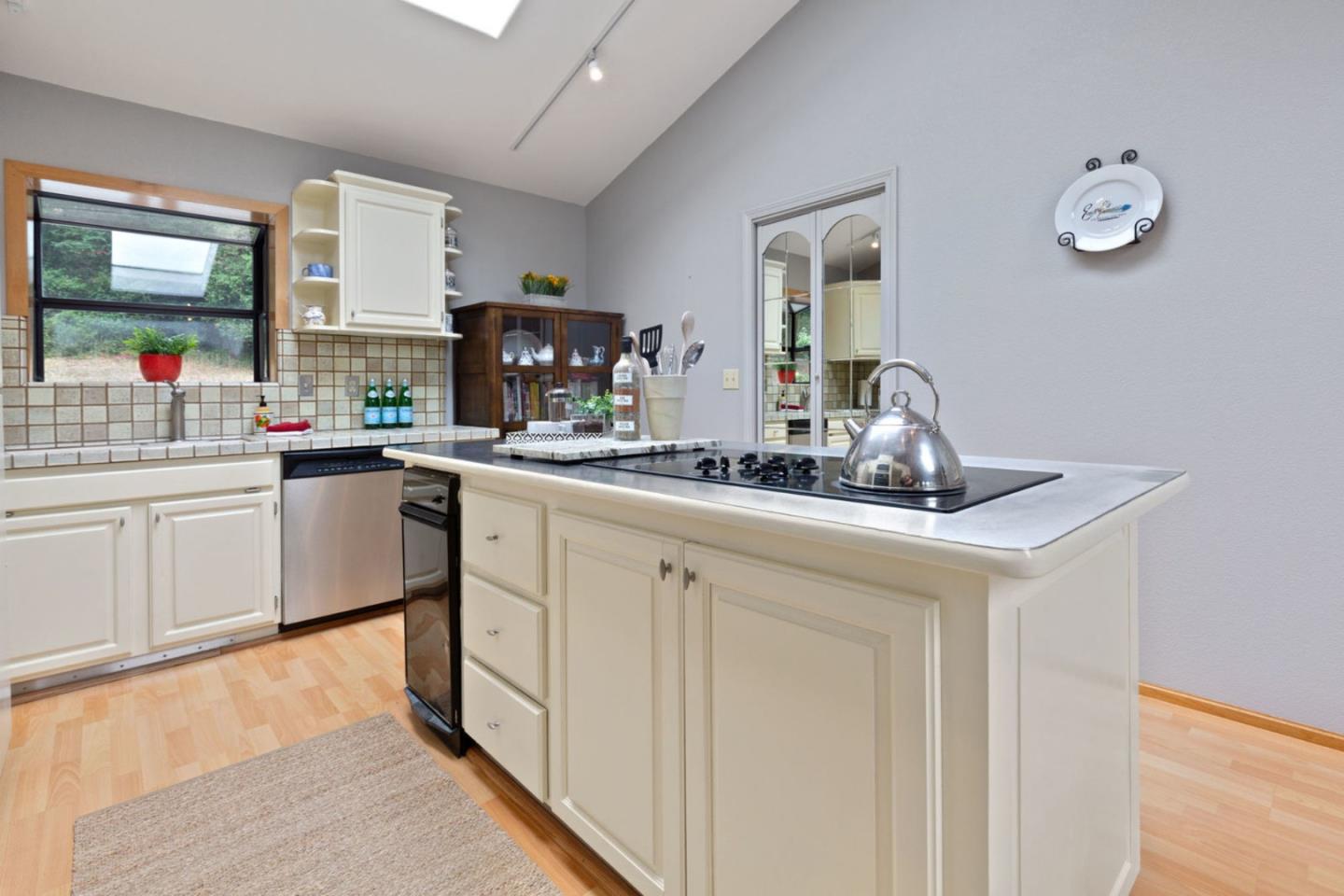 2060 Sparrow Valley Road Aptos, CA 95003 - Photo 15 of 45 a kitchen with a sink cabinets and window