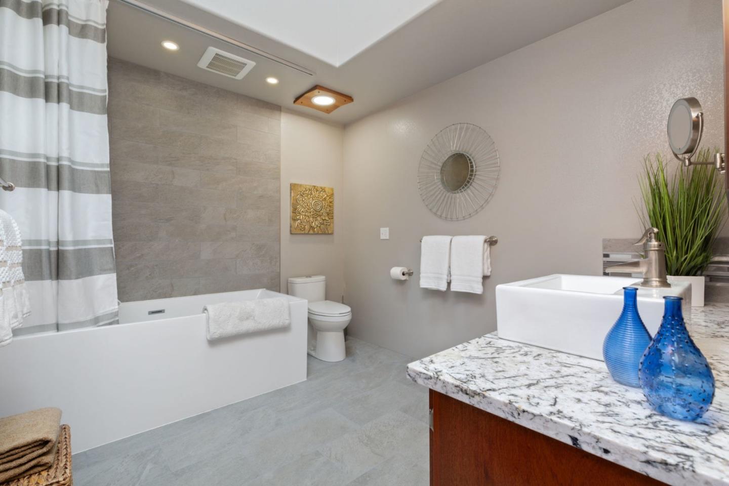 2060 Sparrow Valley Road Aptos, CA 95003 - Photo 19 of 45 a bathroom with a granite countertop sink a toilet and bathtub