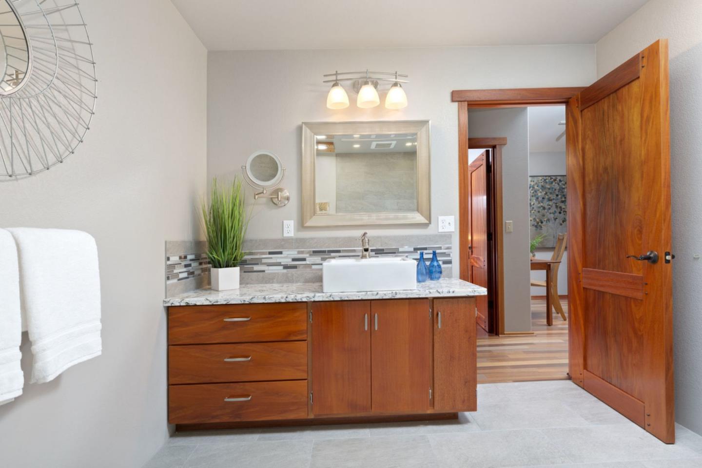 2060 Sparrow Valley Road Aptos, CA 95003 - Photo 20 of 45 a bathroom with a granite countertop sink and a mirror