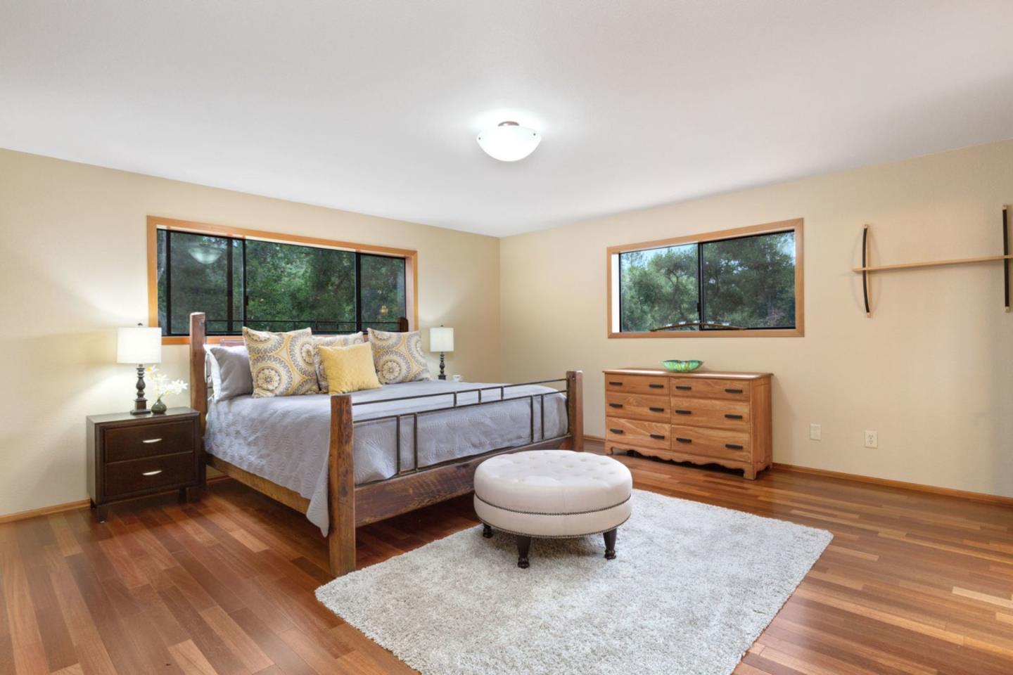 2060 Sparrow Valley Road Aptos, CA 95003 - Photo 21 of 45 a bedroom with a bed and wooden floor
