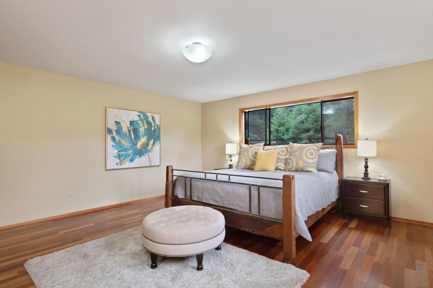 2060 Sparrow Valley Road Aptos, CA 95003 - Photo 22 of 45 a bedroom with a bed and wooden floor