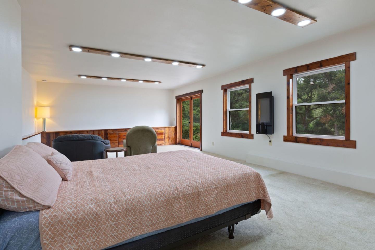 2060 Sparrow Valley Road Aptos, CA 95003 - Photo 32 of 45 a bedroom with a large bed and a large window